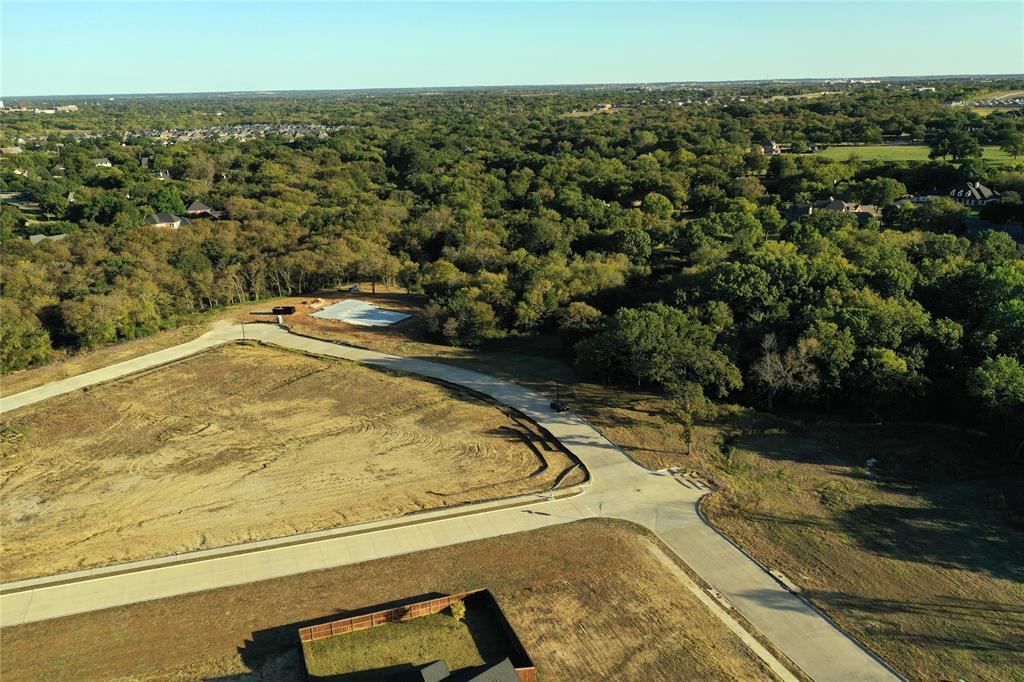 2712 Spring Lake Drive Sherman, TX 75092 - Photo 1 of 37 a view of a swimming pool with a yard