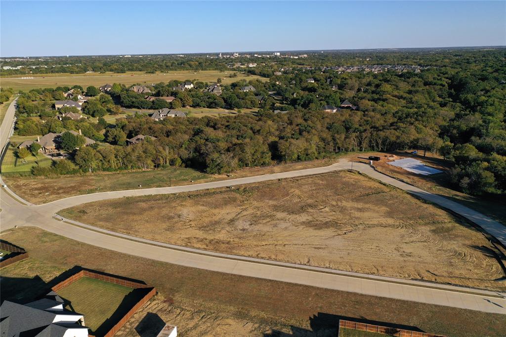 2712 Spring Lake Drive Sherman, TX 75092 - Photo 9 of 37 an aerial view of residential houses with outdoor space and trees