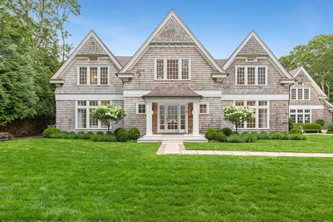 front view of a house next to a yard