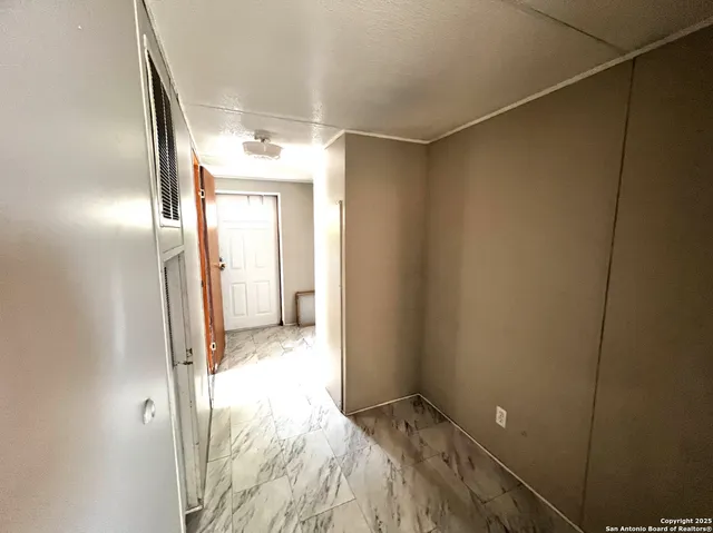 a view of a bathroom with a sink and a mirror