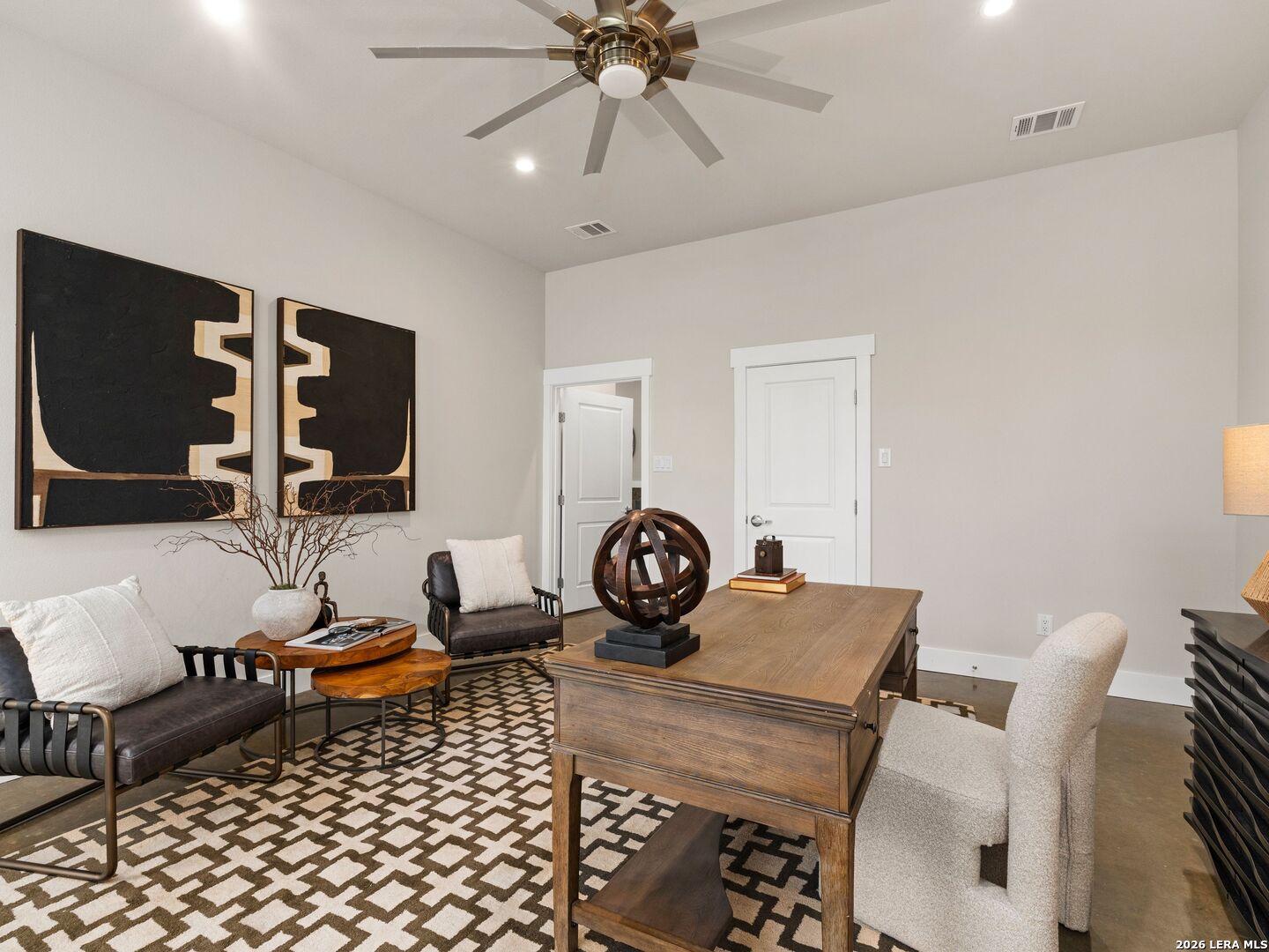 1146 Victoria Avenue Spring Branch, TX 78070 - Photo 36 of 89 a living room with furniture a rug and a chandelier
