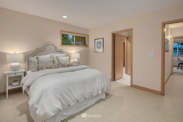 a bedroom with a bed and a night stand