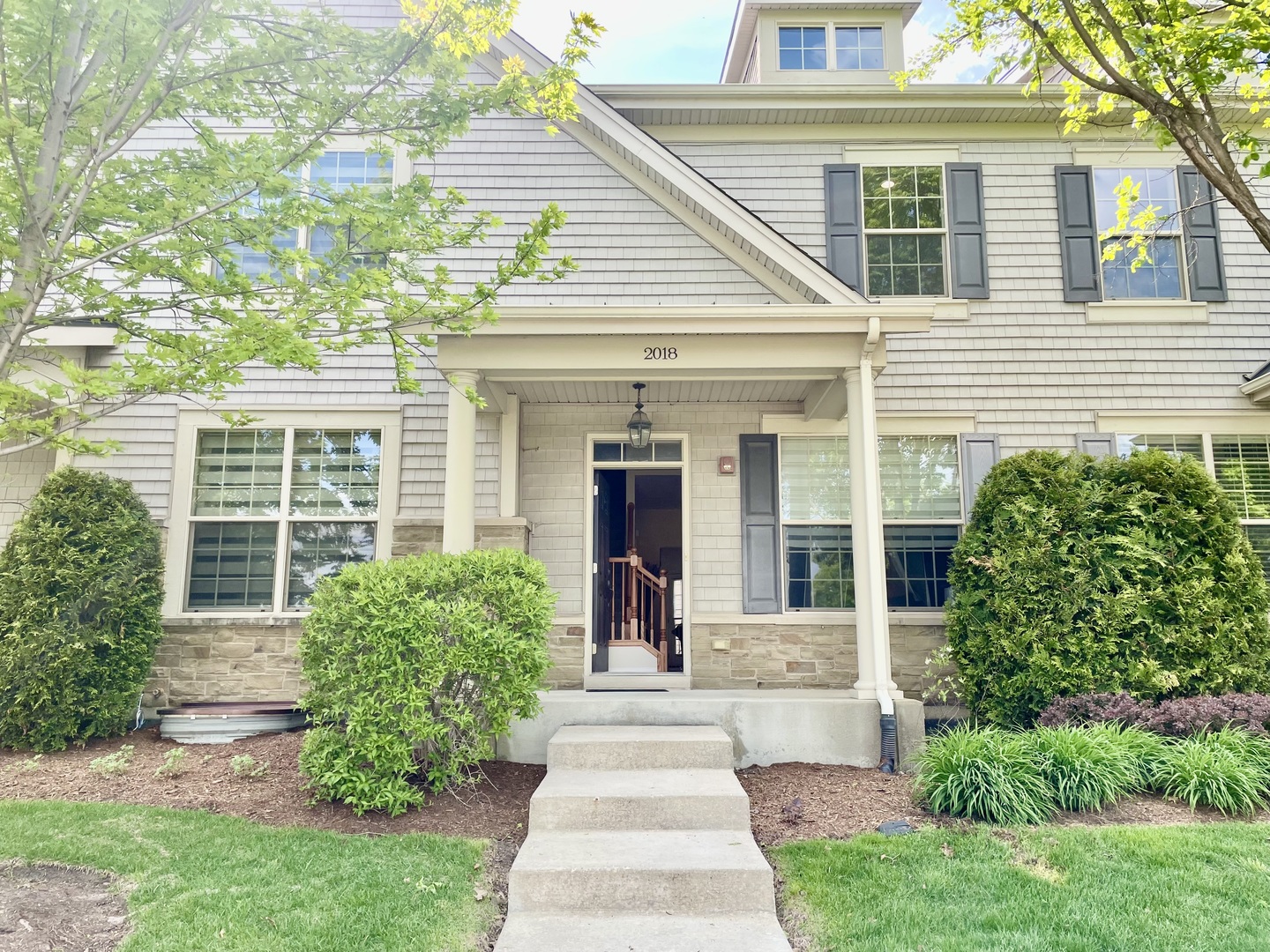 2018 Shermer Road, Unit 2018 Glenview, IL 60026 - Photo 2 of 39 a front view of a house with garden