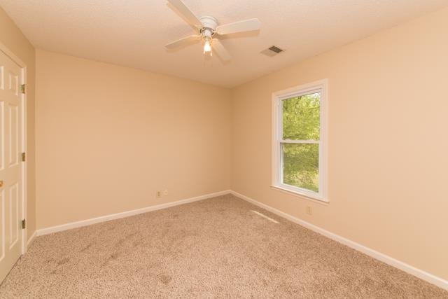 4045 Sawmill Road Woodlawn, TN 37191 - Photo 14 of 20 Bedroom #3 has been freshly painted, NEW carpet, XL closet and ceiling fans!