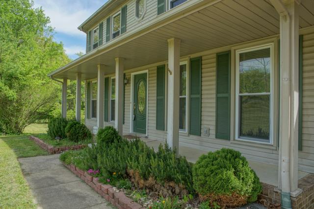 4045 Sawmill Road Woodlawn, TN 37191 - Photo 2 of 20 Perfect country front porch that is the entire width of the home!