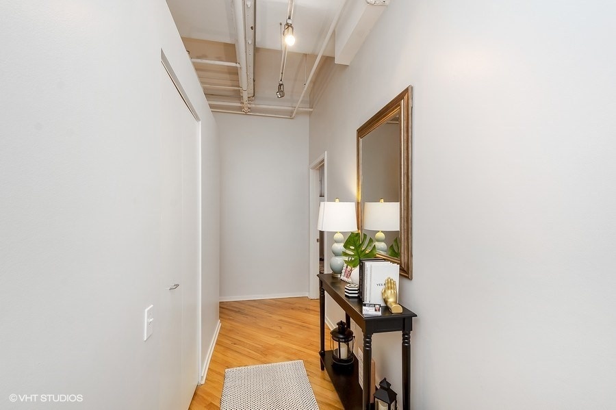 500 South Clinton Street, Unit 404 Chicago, IL 60607 - Photo 6 of 46 a view of an entryway with wooden floor