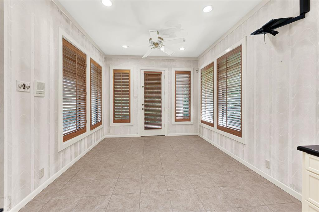 933 Mobley Road Cedar Hill, TX 75104 - Photo 19 of 40 Primary bath hosts dual sinks, garden tub, walk in shower, room for exercise equipment, views of outside. Dual closets with custom built in shelving, lots of storage.