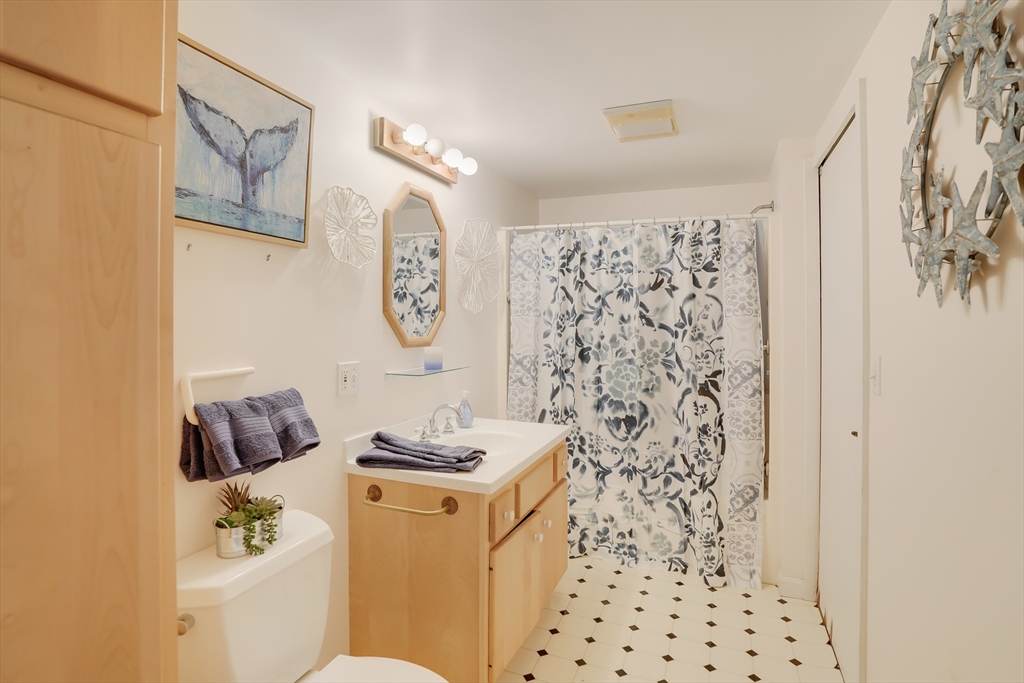 453 Lighthouse Road Aquinnah, MA 02535 - Photo 18 of 39 a bathroom with a sink toilet and vanity
