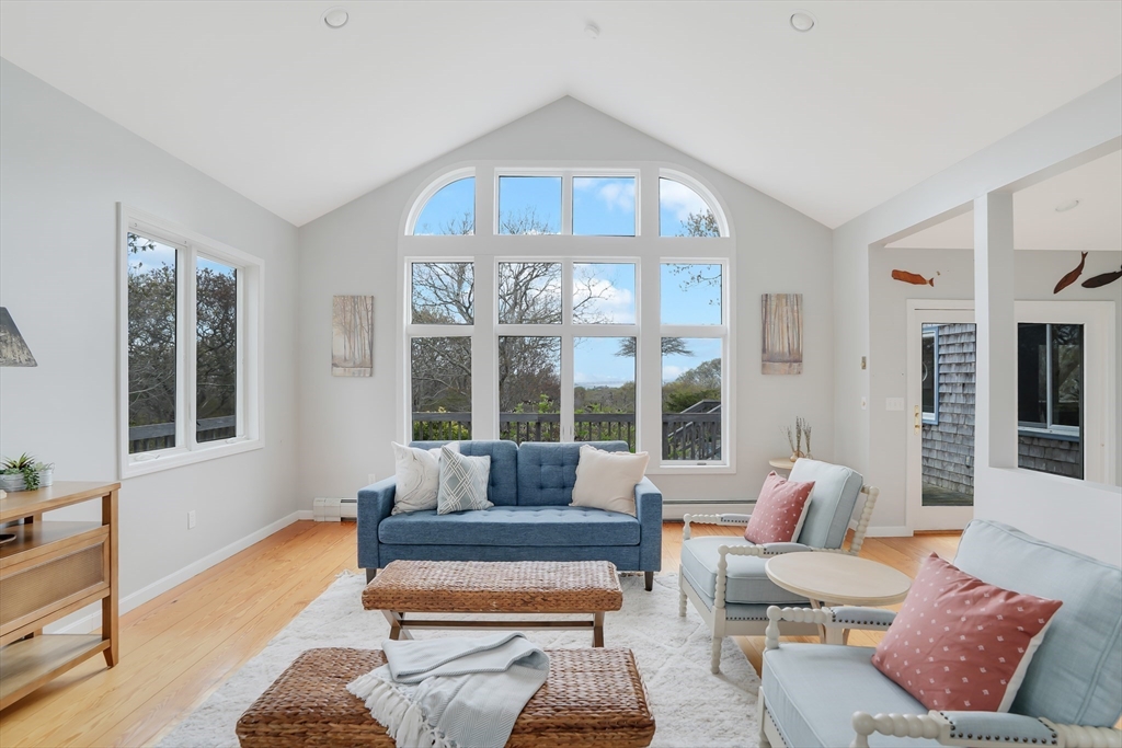 453 Lighthouse Road Aquinnah, MA 02535 - Photo 2 of 39 a living room with furniture and a large window