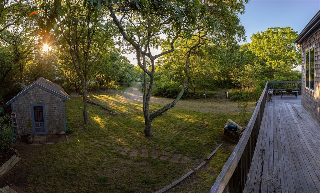 453 Lighthouse Road Aquinnah, MA 02535 - Photo 23 of 39 a view of a house with a yard