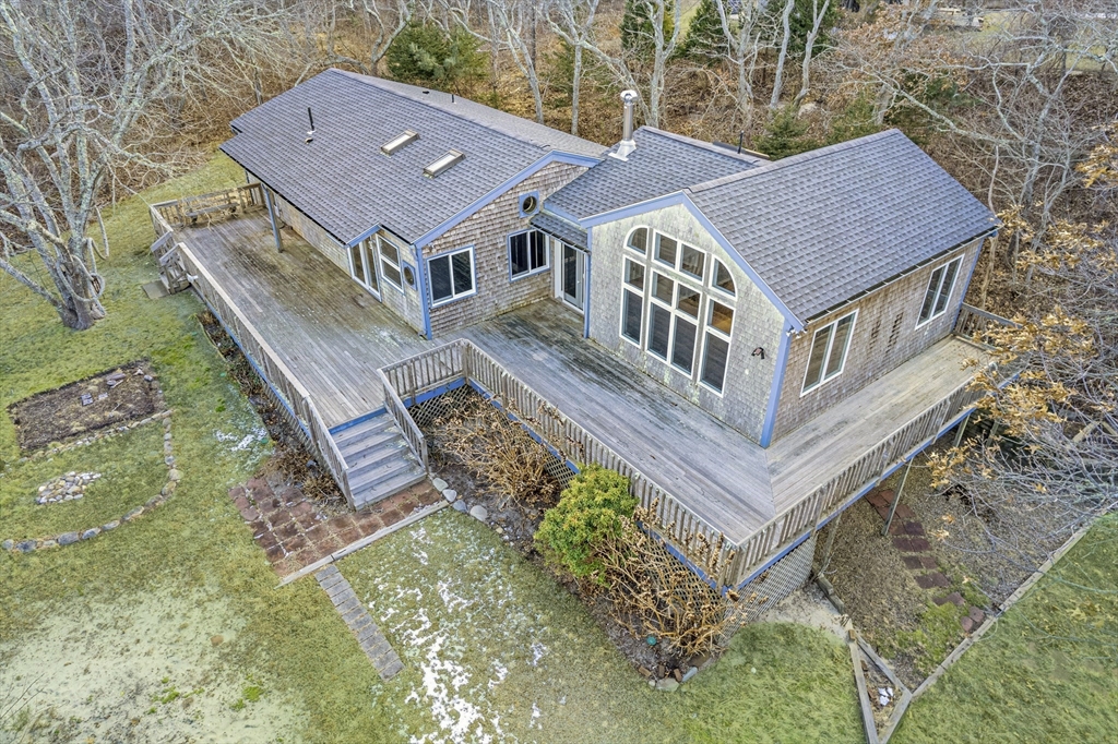 453 Lighthouse Road Aquinnah, MA 02535 - Photo 26 of 39 an aerial view of a house with a yard