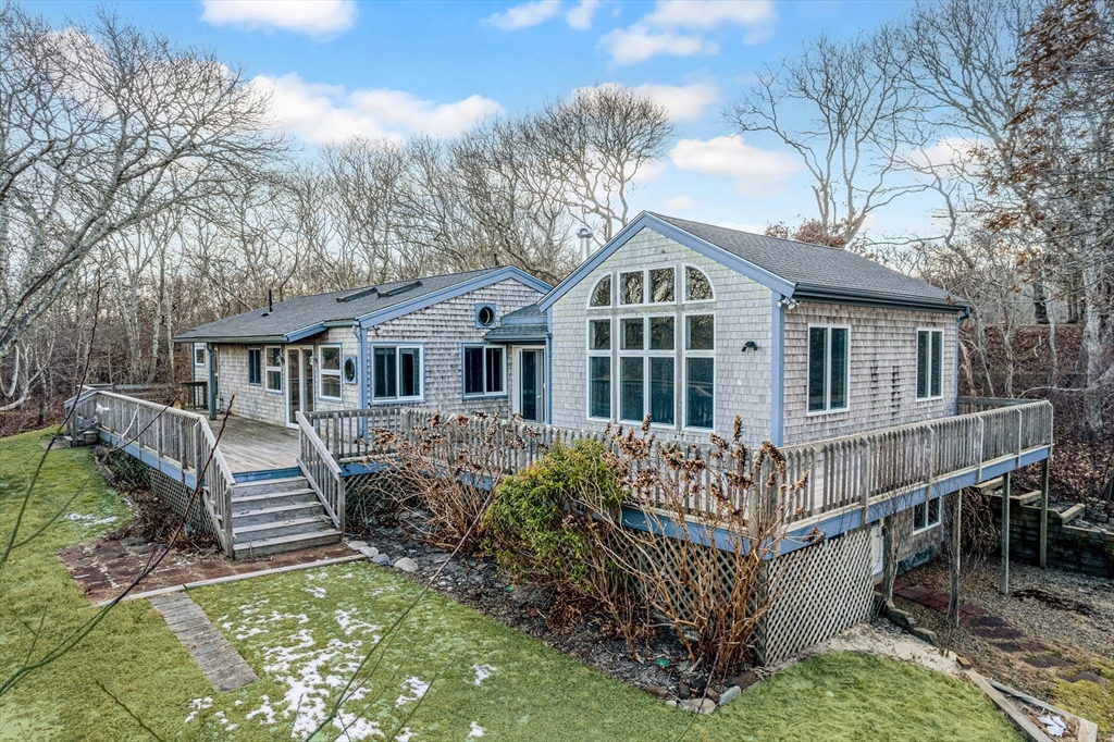 453 Lighthouse Road Aquinnah, MA 02535 - Photo 27 of 39 a front view of a house with a yard