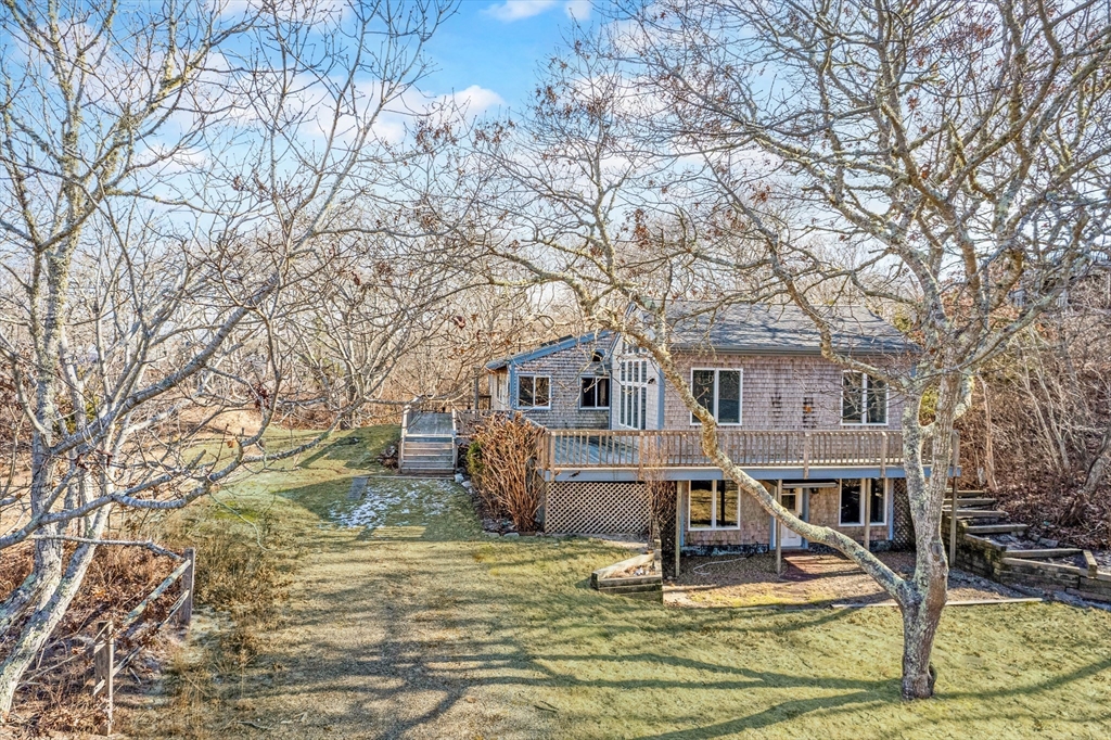 453 Lighthouse Road Aquinnah, MA 02535 - Photo 29 of 39 a view of a house with backyard