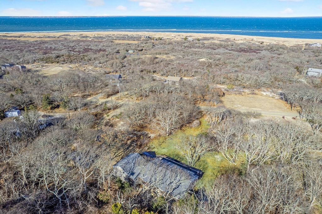 453 Lighthouse Road Aquinnah, MA 02535 - Photo 35 of 39 a view of an ocean beach