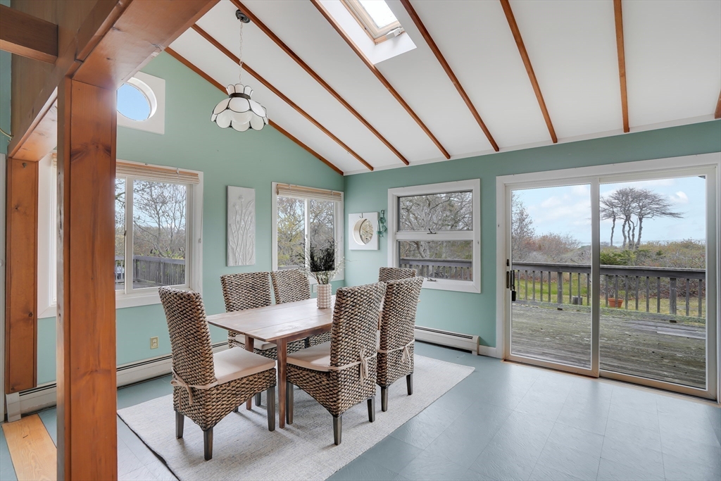 453 Lighthouse Road Aquinnah, MA 02535 - Photo 9 of 39 a view of a dining room with furniture window and wooden floor