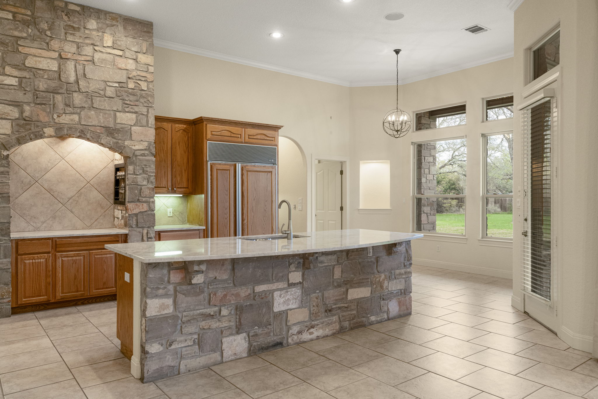 301 Goldridge Drive Georgetown, TX 78633 - Photo 12 of 40 Gorgeous stone accents create an impressive kitchen design.