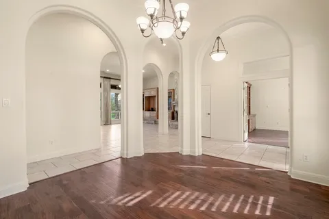a view of a livingroom with wooden floor