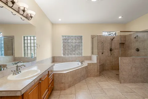 a bath room with a bath tub and a sink