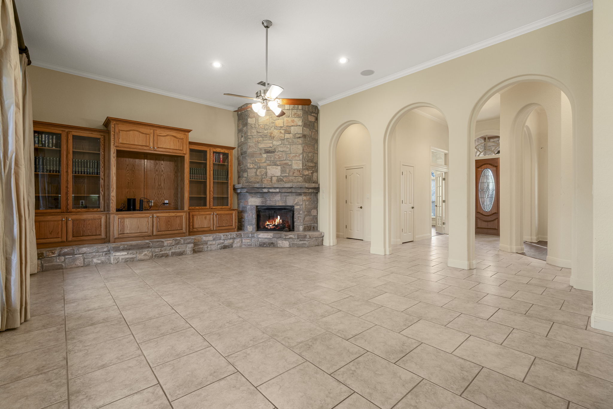 301 Goldridge Drive Georgetown, TX 78633 - Photo 6 of 40 A built-in entertainment center adds character and functionality to the living room.