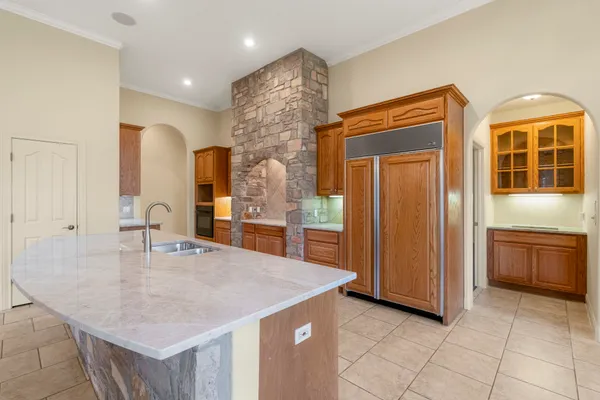 a kitchen with stainless steel appliances granite countertop a sink and cabinets