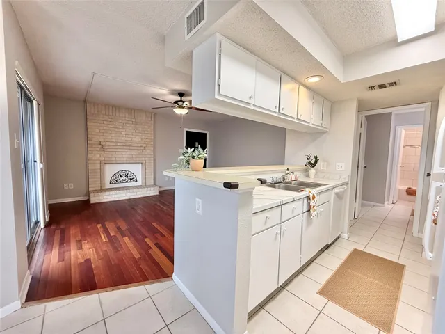 a kitchen with a sink and cabinets