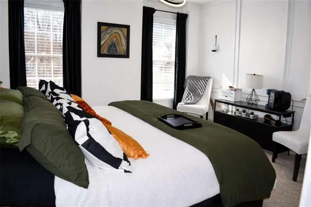 a bedroom with a bed and balcony view