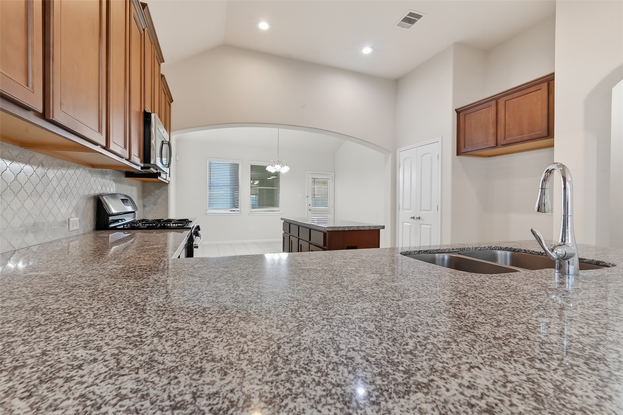 7631 Granite Terrace Lane Houston, TX 77083 - Photo 23 of 46 a view of a kitchen with a sink and cabinets