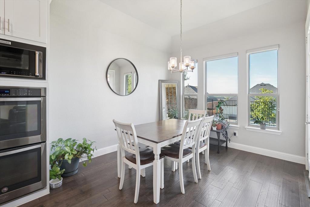 11375 Misty Ridge Drive Flower Mound, TX 76262 - Photo 10 of 39 a view of a dining room with furniture window and wooden floor