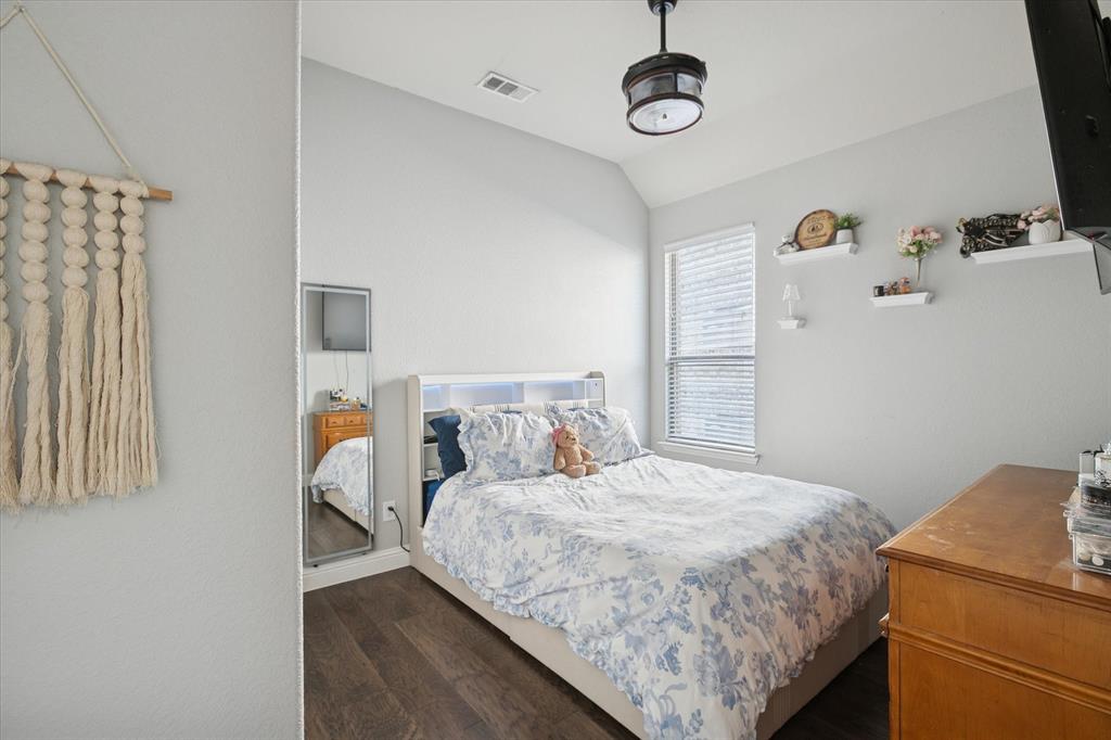 11375 Misty Ridge Drive Flower Mound, TX 76262 - Photo 11 of 39 a bedroom with a bed and window