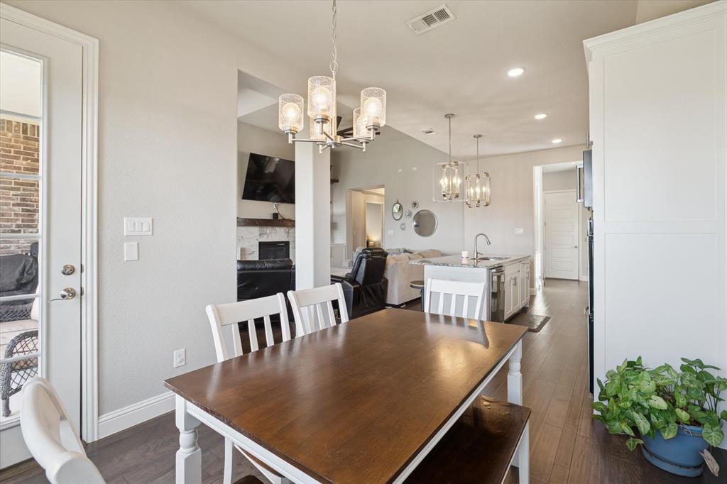 11375 Misty Ridge Drive Flower Mound, TX 76262 - Photo 16 of 39 a view of a dining room with furniture and wooden floor