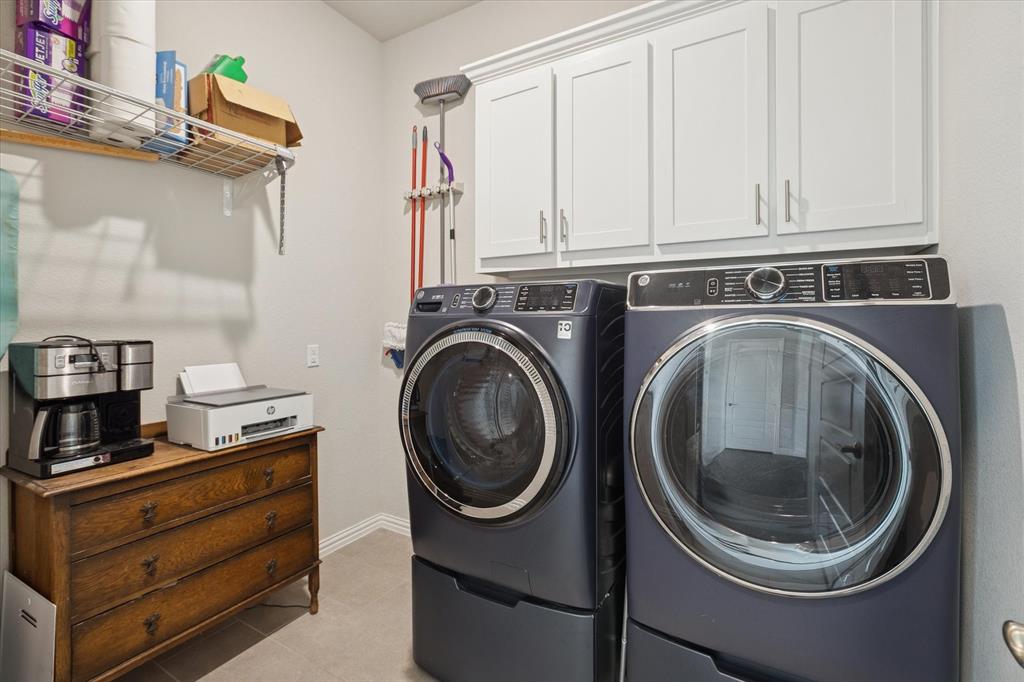 11375 Misty Ridge Drive Flower Mound, TX 76262 - Photo 18 of 39 a utility room with sink dryer and washer