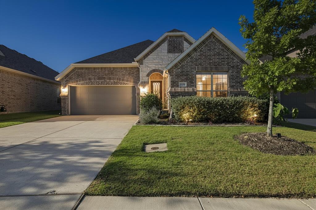 11375 Misty Ridge Drive Flower Mound, TX 76262 - Photo 2 of 39 a front view of a house with garden