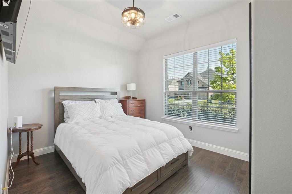 11375 Misty Ridge Drive Flower Mound, TX 76262 - Photo 21 of 36 a large bed sitting in a bedroom next to a window