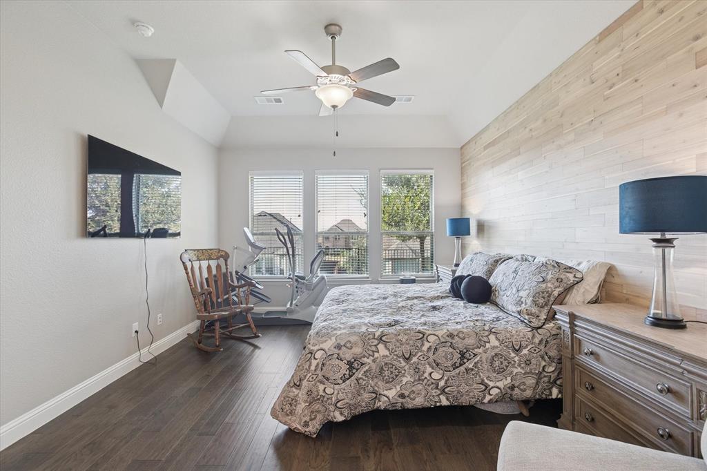 11375 Misty Ridge Drive Flower Mound, TX 76262 - Photo 21 of 39 a bedroom with a bed couch and a window