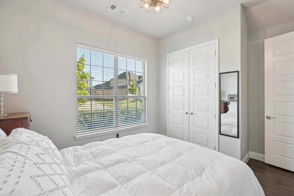 11375 Misty Ridge Drive Flower Mound, TX 76262 - Photo 22 of 36 a bedroom with a bed and a window