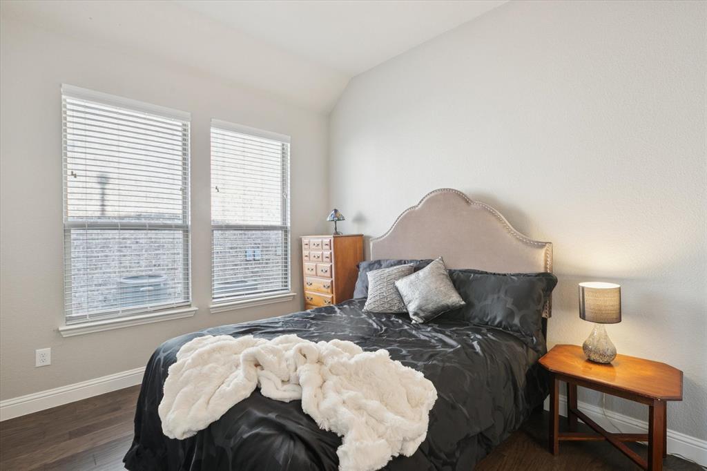 11375 Misty Ridge Drive Flower Mound, TX 76262 - Photo 25 of 36 a bedroom with a bed and wooden floor