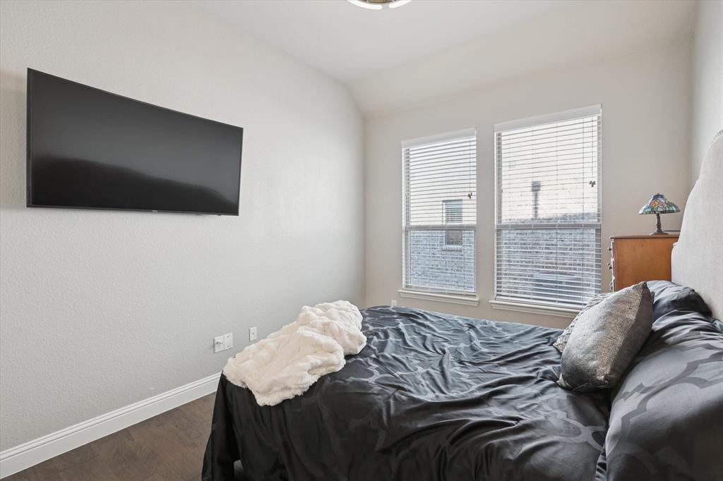 11375 Misty Ridge Drive Flower Mound, TX 76262 - Photo 27 of 39 a bedroom with a bed and a flat screen tv