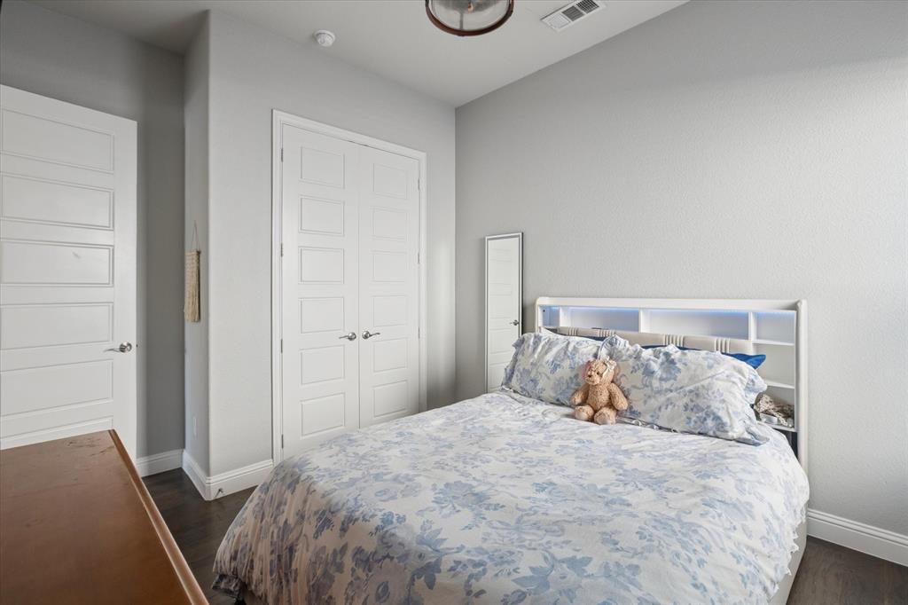 11375 Misty Ridge Drive Flower Mound, TX 76262 - Photo 29 of 36 a bedroom with a bed and a window