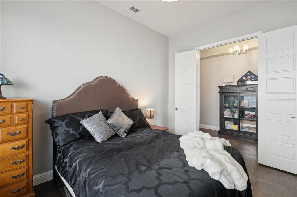 11375 Misty Ridge Drive Flower Mound, TX 76262 - Photo 29 of 39 a bedroom with a bed and a night stand