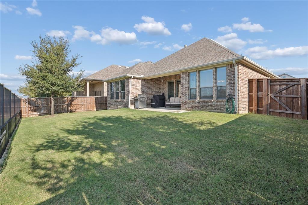 11375 Misty Ridge Drive Flower Mound, TX 76262 - Photo 30 of 36 a front view of a house with a yard and trees