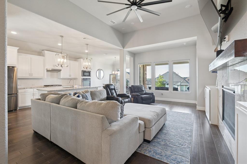 11375 Misty Ridge Drive Flower Mound, TX 76262 - Photo 5 of 36 a living room with furniture and a large window with kitchen view