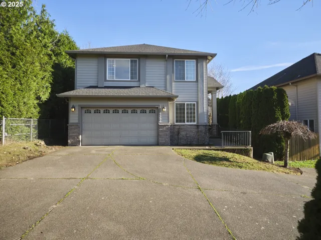 a front view of a house with yard