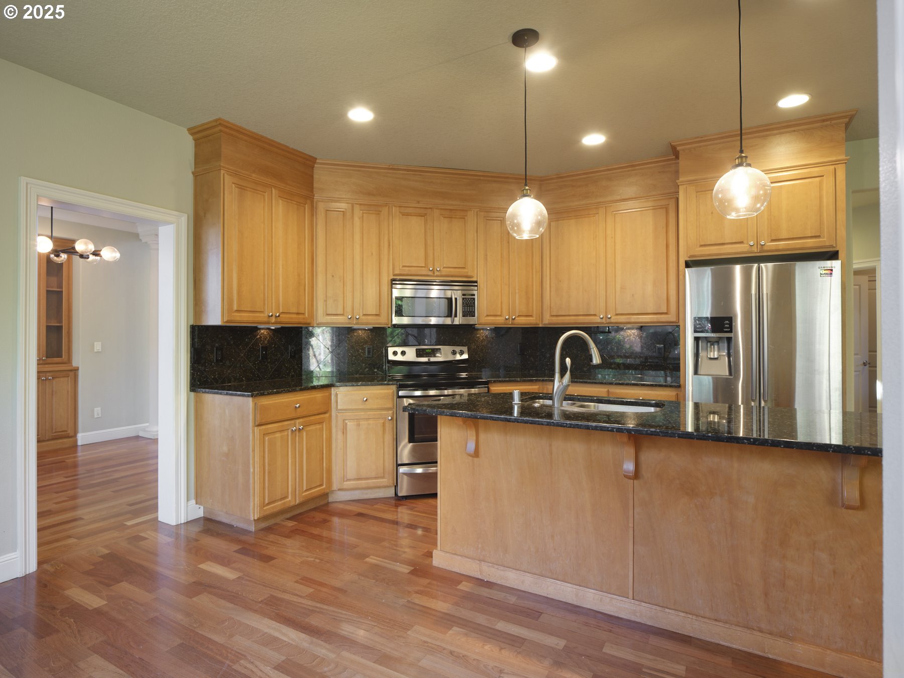 10410 Southeast French Road Vancouver, WA 98664 - Photo 14 of 43 a kitchen with stainless steel appliances granite countertop a sink a stove and a refrigerator