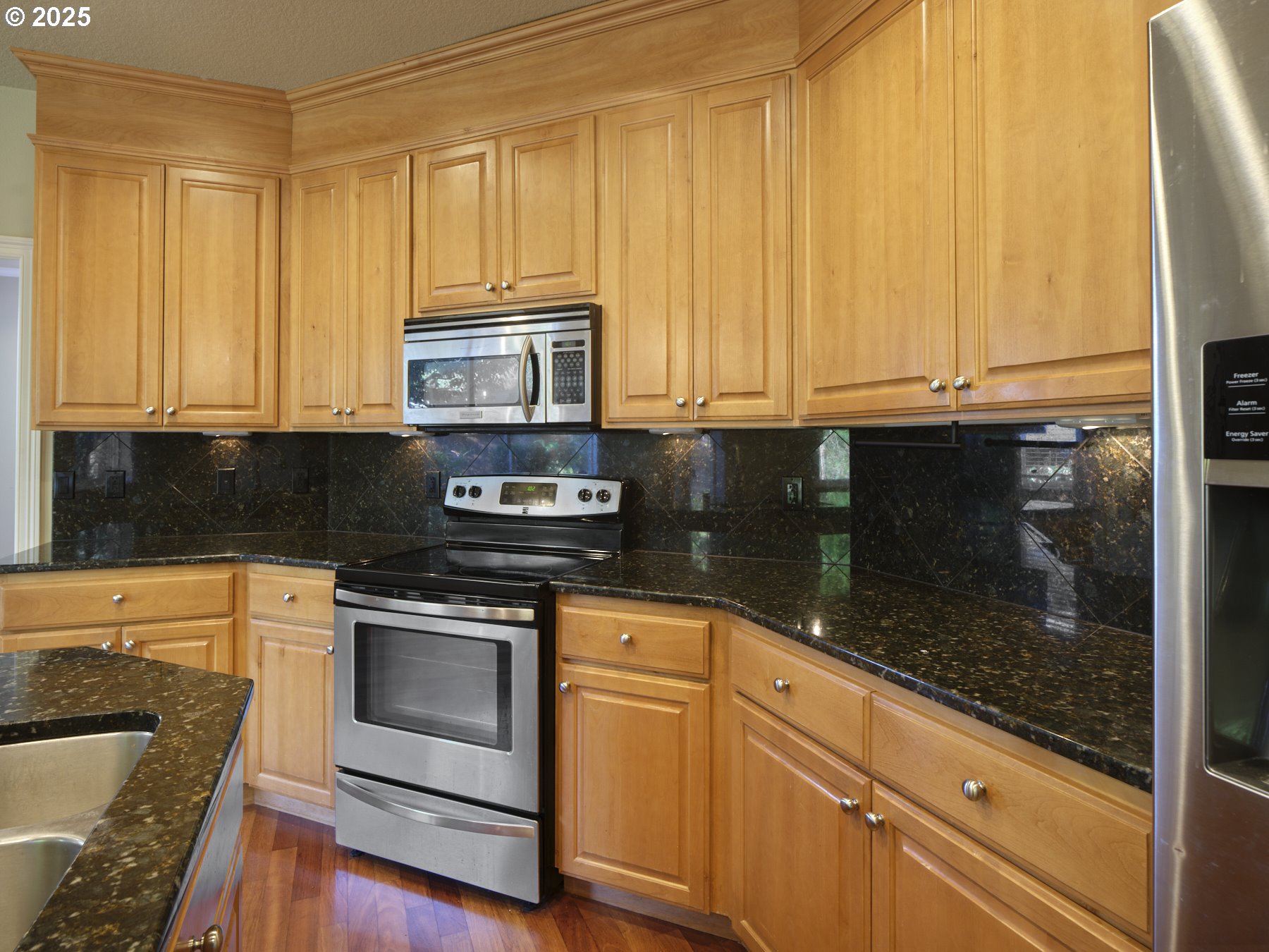 10410 Southeast French Road Vancouver, WA 98664 - Photo 17 of 43 a kitchen with granite countertop wooden cabinets and stainless steel appliances