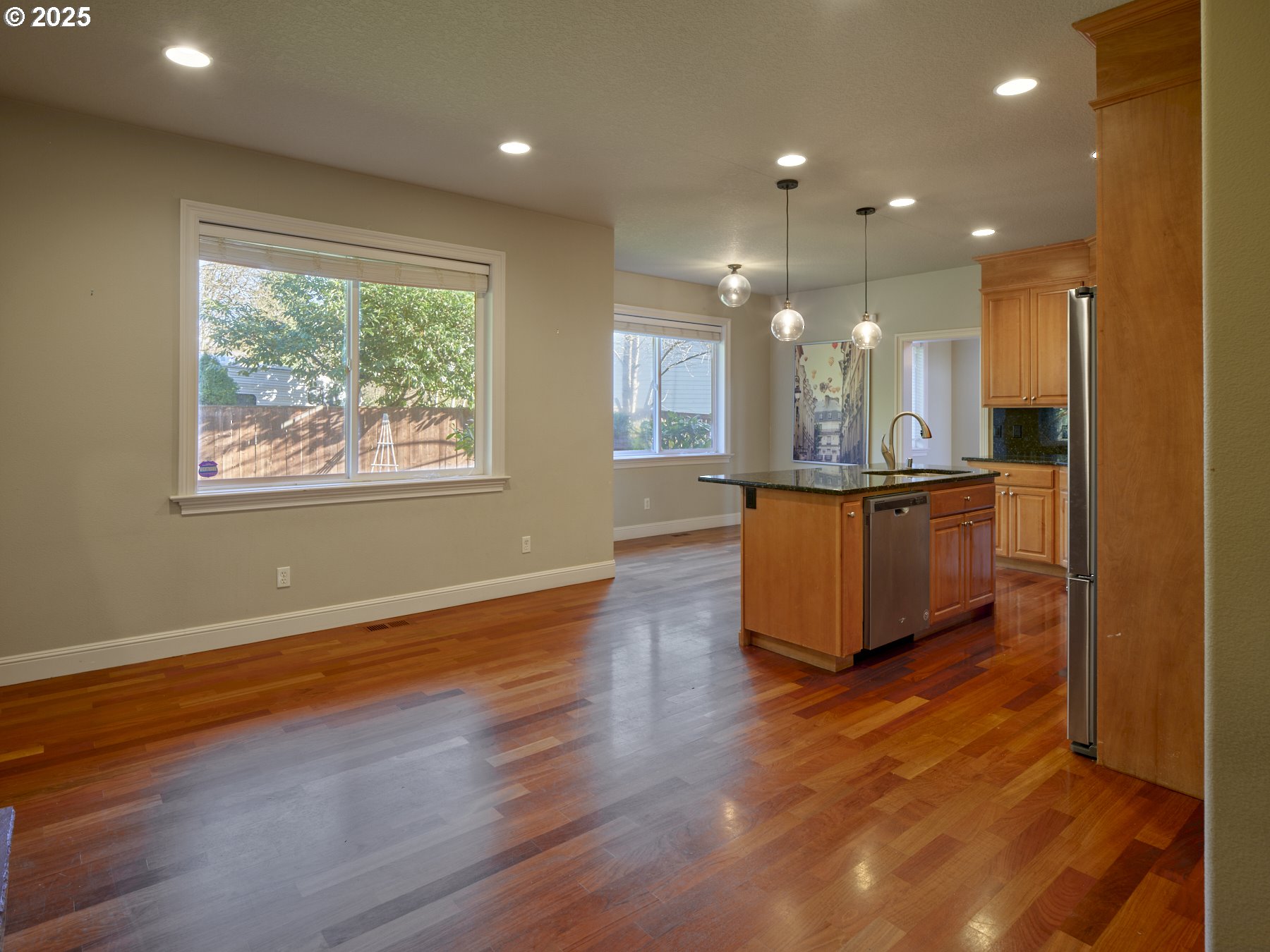 10410 Southeast French Road Vancouver, WA 98664 - Photo 20 of 43 an open kitchen with kitchen island granite countertop wooden floor and a sink