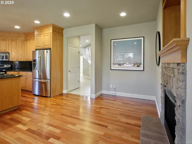 a view of a kitchen cabinets and wooden floor