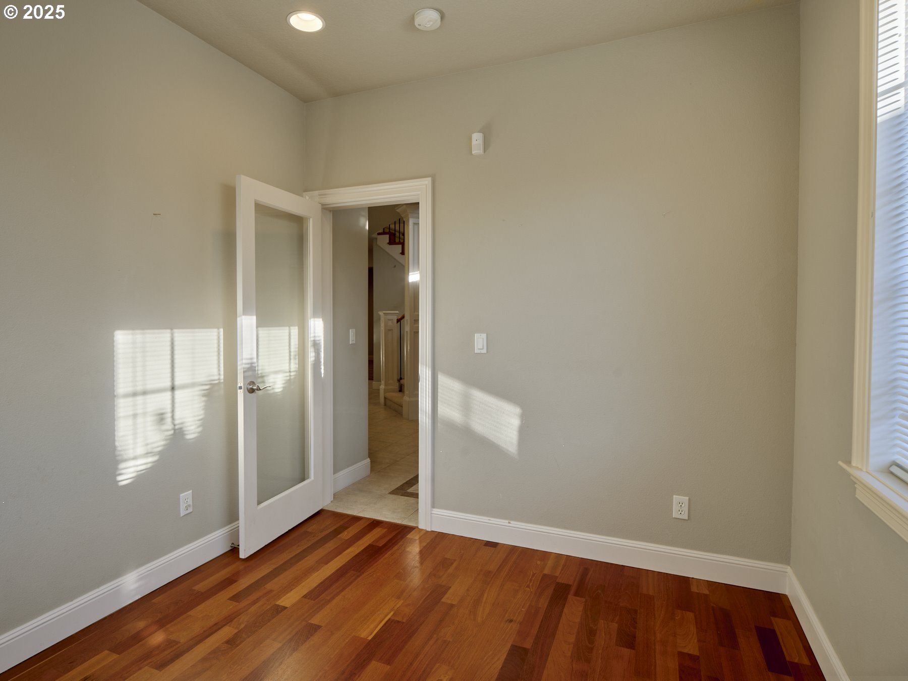 10410 Southeast French Road Vancouver, WA 98664 - Photo 25 of 43 an empty room with wooden floor and windows