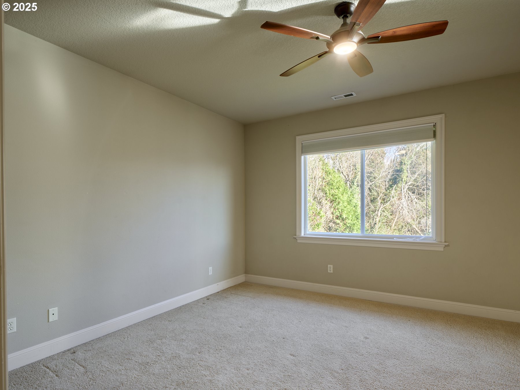 10410 Southeast French Road Vancouver, WA 98664 - Photo 27 of 43 an empty room with a window and a fan