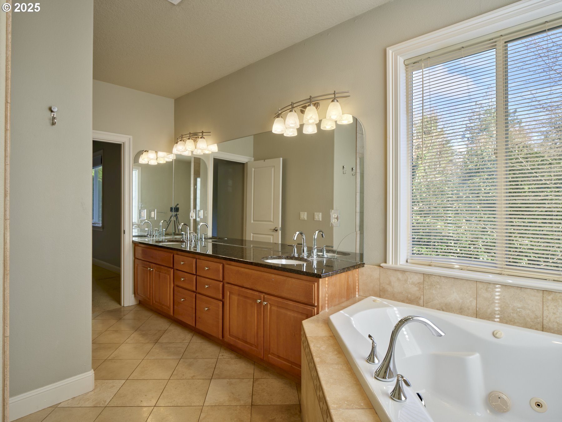 10410 Southeast French Road Vancouver, WA 98664 - Photo 31 of 43 a large bathroom with a large tub and sink