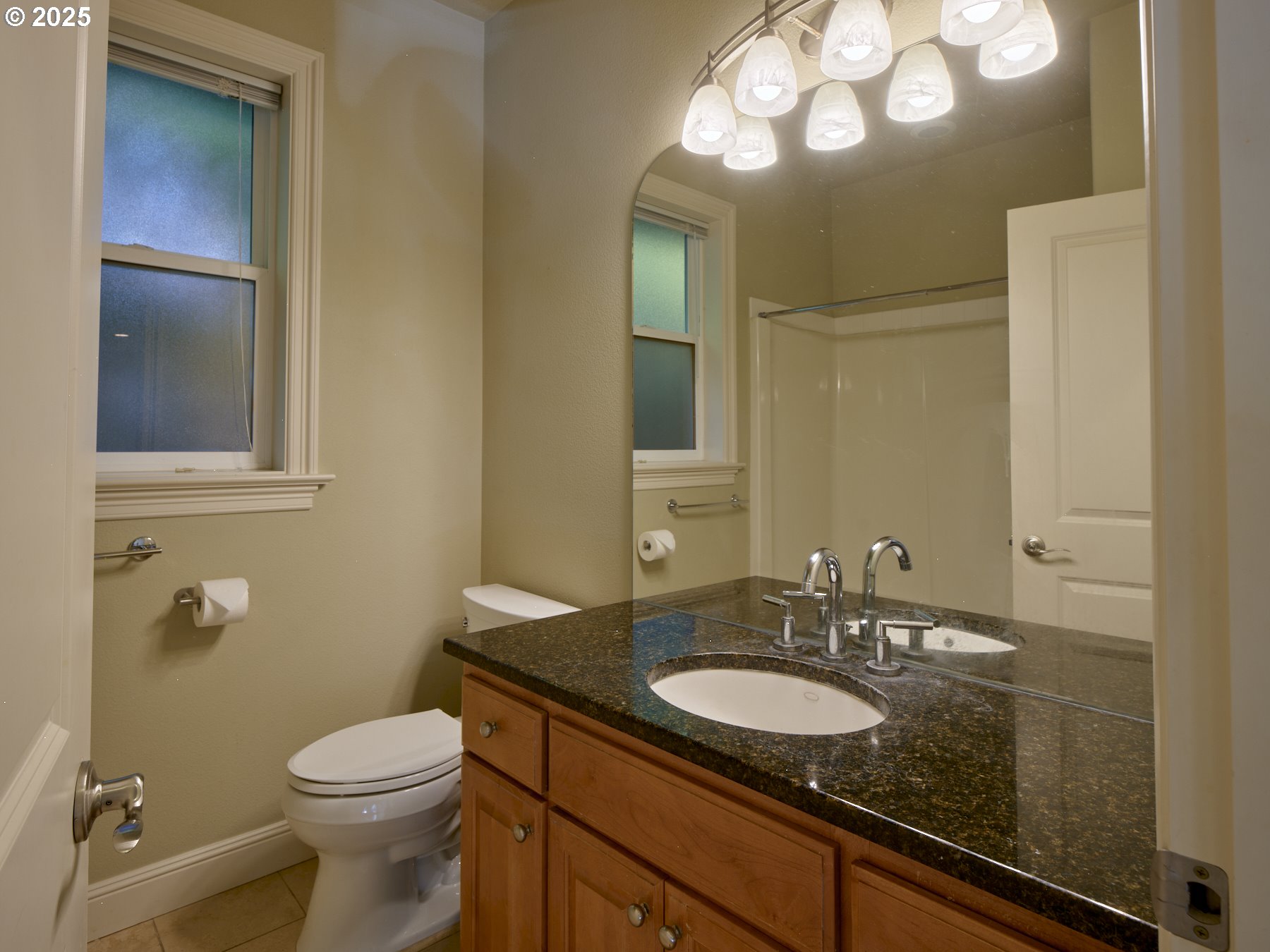 10410 Southeast French Road Vancouver, WA 98664 - Photo 34 of 43 a bathroom with a sink a toilet and a mirror